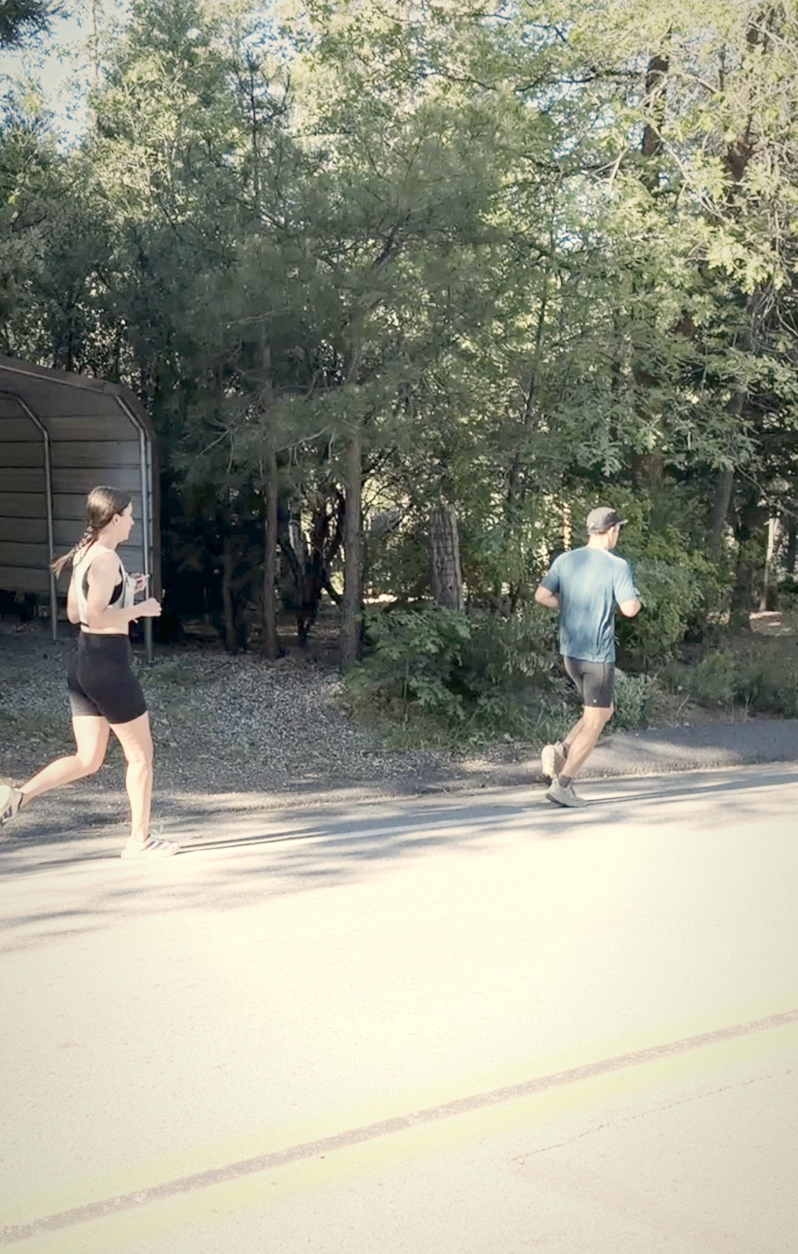 Two runners on a morning road
